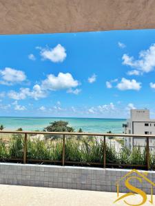 a view of the beach from the balcony of a condo at Ble Camboinha 101 in Camalaú