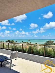 a balcony with a view of the ocean at Ble Camboinha 101 in Camalaú