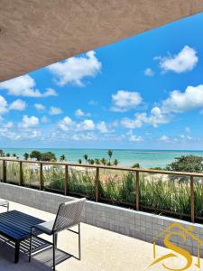 a balcony with a view of the ocean at Ble Camboinha 101 in Camalaú +40 photos