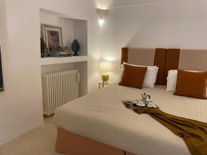 a bedroom with a large bed with a tray on it at Dimora Lùmina in Gallipoli