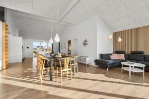 a living room with a table and a couch at SB128-Krusa-Hyldemose-23 in Skovbyballe
