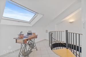 a room with a desk and a window at Appartement à Schifflange in Schifflange