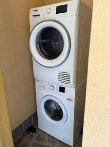 a washer and dryer stacked on top of each other at Casa Menotti in Carate Brianza