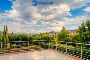 a balcony with a view of the city at Dreamers B&B in Maseru