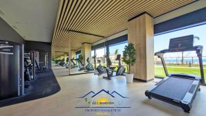 a gym with a row of treadmills and ellipticals at Nini Sunset Sailor Luxury Apartment in Benidorm