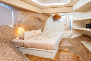 a bedroom with a large bed in a room at The Rock Samui Beach Resort in Lamai +33 photos