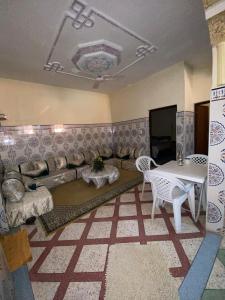a living room with a couch and a table at GUESTS Of TATA in Tatta
