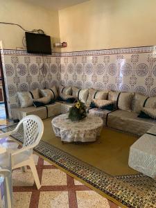 a living room with a couch and a table at GUESTS Of TATA in Tatta