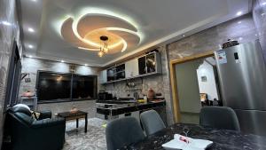 a room with a kitchen and a living room at Villa isouktan in Sbiti