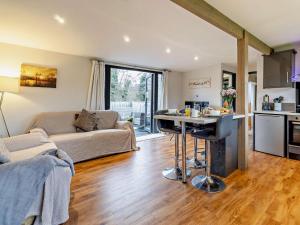 a kitchen and living room with a couch and a table at 2 Bed in Norwich oc-73624 in East Harling +8 photos