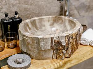 a wooden tub sitting on top of a wooden table at 3 Bed in Newquay oc-90070 in Newquay +24 photos