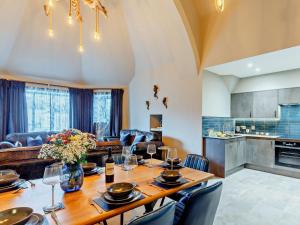 a dining room and living room with a table and chairs at 4 Bed in Newquay oc-90069 in Newquay