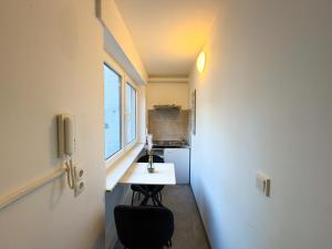a small room with a sink and a window at CityStay Montabaur in Montabaur +18 photos