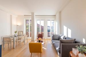 a living room with a couch and a table at Milan Royal Suites - Centro in Milan