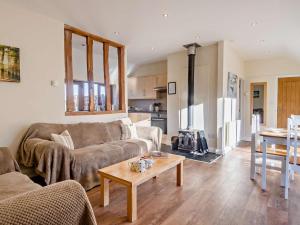 a living room with a couch and a table at 2 Bed in Norwich oc-64075 in East Harling +12 photos