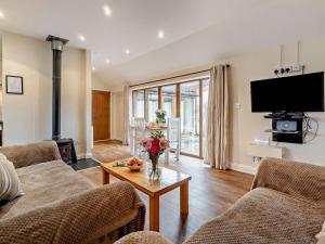 a living room with two couches and a tv at 2 Bed in Norwich oc-64075 in East Harling