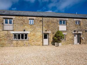 an old stone house with a large driveway at 2 Bed in Camelford oc-81245 in Camelford