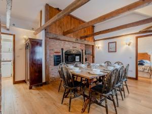 a dining room with a wooden table and chairs at 4 Bed in Eastbourne oc-71297 in Eastbourne +17 photos
