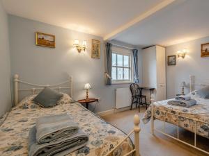 a bedroom with two beds and a window at 4 Bed in Eastbourne oc-71297 in Eastbourne