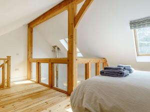 a bedroom with a bed and a large window at 1 Bed in Helston oc-82496 in Ruan Minor