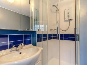 a bathroom with a sink and a shower at 2 Bed in Fowey oc-76624 in Fowey +7 photos