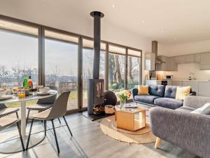 a living room with a couch and a table and a fireplace at 2 Bed in Colchester oc-95941 in East Bergholt