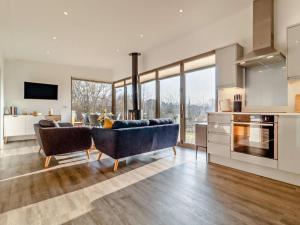 a living room with a couch and a kitchen at 2 Bed in Colchester oc-95941 in East Bergholt