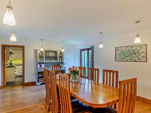 a dining room with a wooden table and chairs at 4 Bed in Boscastle oc-47035 in Boscastle
