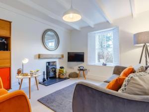 a living room with a couch and a fireplace at 2 Bed in Par- oc-81252 in Saint Blazey