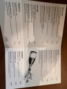 a box with a glass of wine on it at King Alfred Hotel in Barrow in Furness