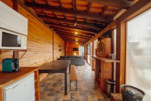 a kitchen with a table and a couch in a room at Douro Views Terrace House by Vacationy in Bandeira