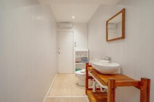 a bathroom with a sink and a toilet at Douro Views Terrace House by Vacationy in Bandeira +26 photos