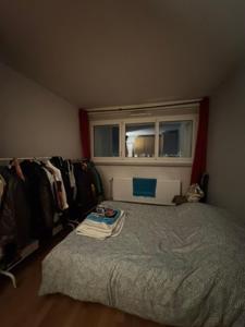 a small bedroom with a bed and a window at Eiffel Tower view & Swimming Pool, Cosy appartment - Center in Paris +28 photos