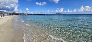 a view of a beach with the ocean at Hotel Stefania Boutique Hotel by the Beach in Olbia