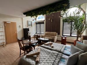 a living room with a couch and a table at Villa Louis Hirsch in Gera