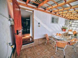 a room with a table and chairs in a room at MatSofy_Apartamento in Santiago