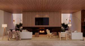 a living room with a fireplace and a tv at The Lince Ecorkhotel Évora in Évora
