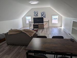 a living room with a couch and a table at Apartment 1 in Rockingham
