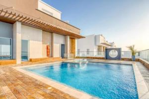 a swimming pool in the backyard of a house at Beachfront 2BR Luxury Living Walk Everywhere in Cartagena de Indias
