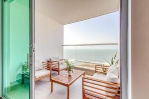a living room with a view of the ocean at Beachfront 2BR Luxury Living Walk Everywhere in Cartagena de Indias