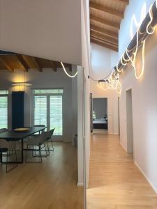 a dining room and living room with a table and chairs at D&D Guesthouse in Angelbachtal +14 photos