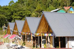 a row of houses with flags hanging from them at Amarvi Hotel & Resort in Kalimpong
