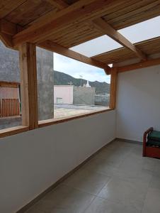 a room with a window with a view of a building at Casa del Abuelo in Tabernas