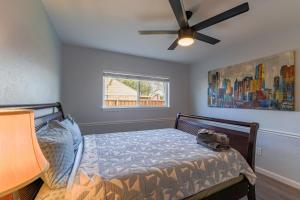 a bedroom with a bed with a ceiling fan at Modern 4 Bedroom home with large, fenced backyard, Pet friendly - 20 mins to DFW Airport in Flower Mound