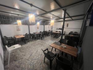 a restaurant with tables and chairs in a room at Karhal Room in Edirne