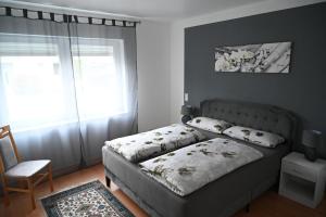 a bedroom with a bed with pillows on it at Ferienwohnung Lindlar in Lindlar