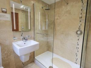 a bathroom with a sink and a shower at Thrang View in Ambleside +29 photos