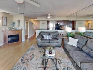 a living room with a couch and a table at Surfside Six E Unit 5 in St. Augustine