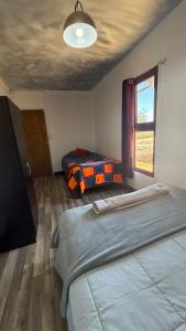a bedroom with two beds and a window at La Finca - Santa Cruz - Chile in Santa Cruz