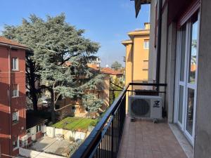 a balcony with a air conditioner on a building at Suite Prisma - Modern & Spacious Apartment near Verona Fair in Verona